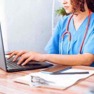 nurse working on a laptop