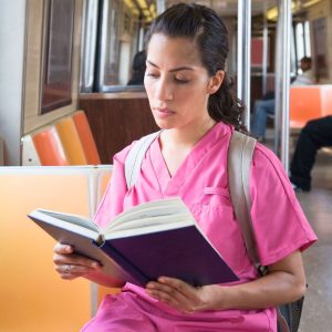 a nurse reading about Travel Nursing Misconceptions